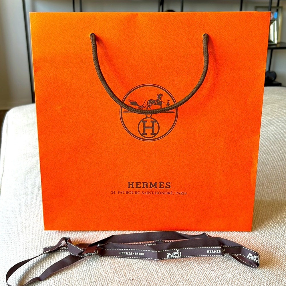Authentic Hermes shopping bag and ribbon.